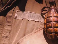 Граната на военной куртке